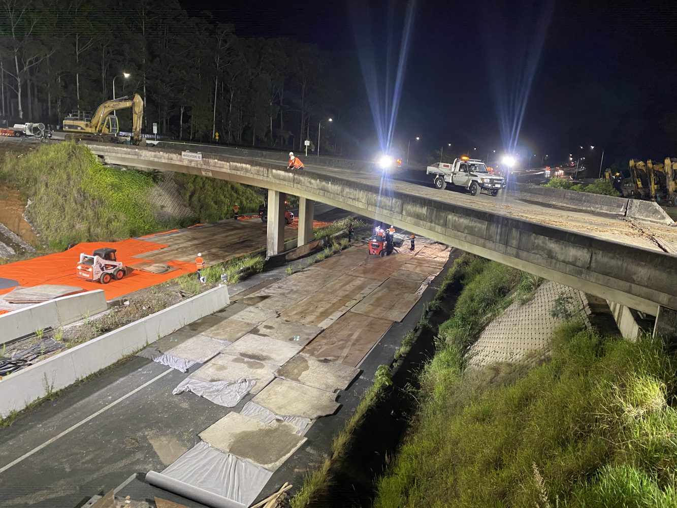 Geofabric, protective mats and steel plates installed to prevent damage to the highway roads.