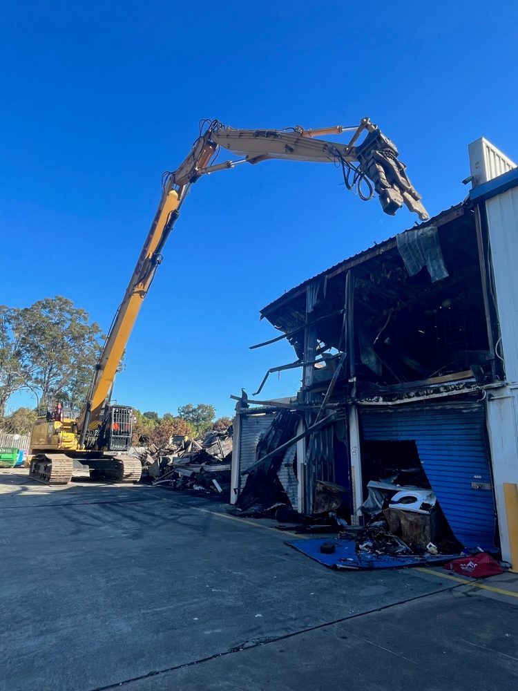 High reach excavator demolition