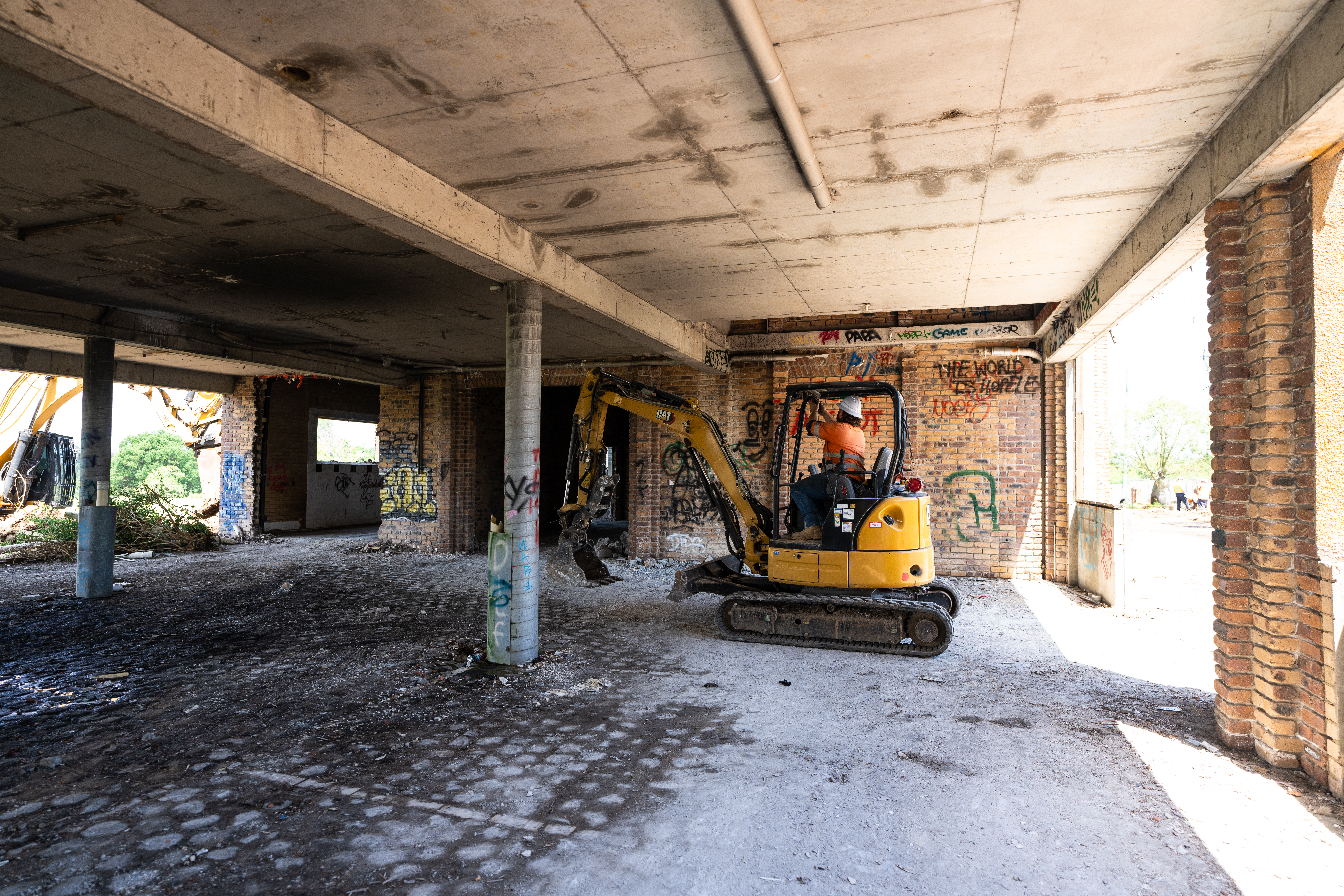 Demolition of inside of building using small excavator Demolition of inside of building using small excavator