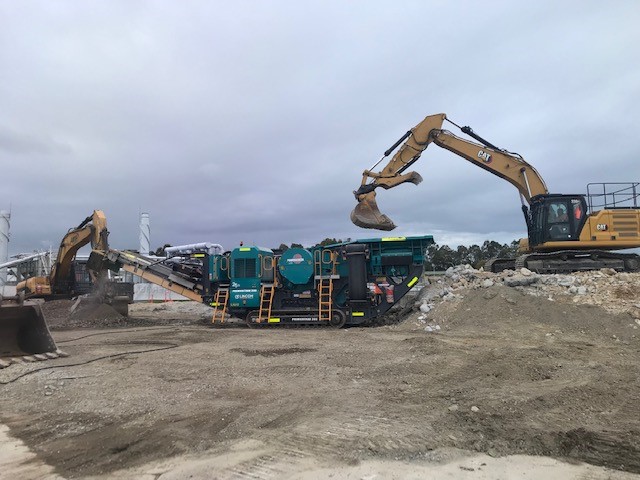 Merrimac STP - concrete crusher Concrete crusher used on demolition site